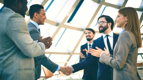 Candidate being congratulated after interview, as a result of a strong CV and thorough preparation